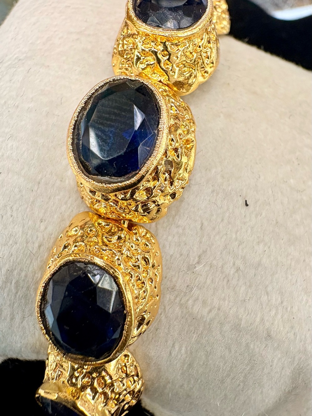 Gold-Tone No TarnishBracelet Cuff with Dark Blue Faceted Stones. Solid open cuff